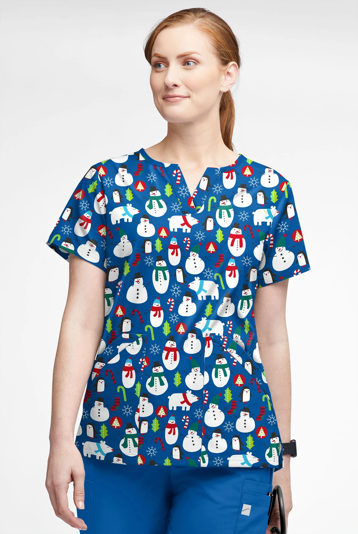 Butter-Soft North Pole Party Royal Women’s 4-Pocket V Notch-Neck Print Scrub Top 4 Butter-Soft North Pole Party Royal Women’s 4-Pocket V Notch-Neck Print Scrub Top - Image 2